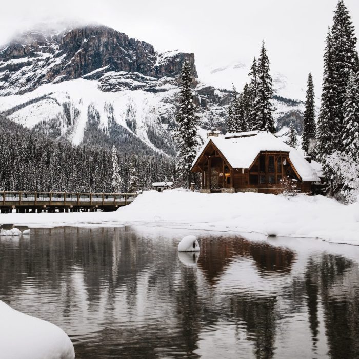 A small wooden house covered with snow near the Emerald Lake in Canada in winter